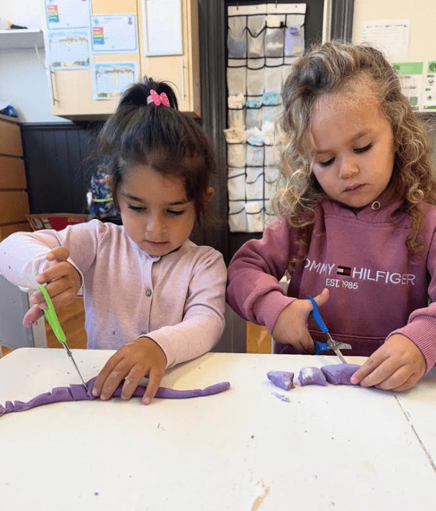 Children writing on workbook