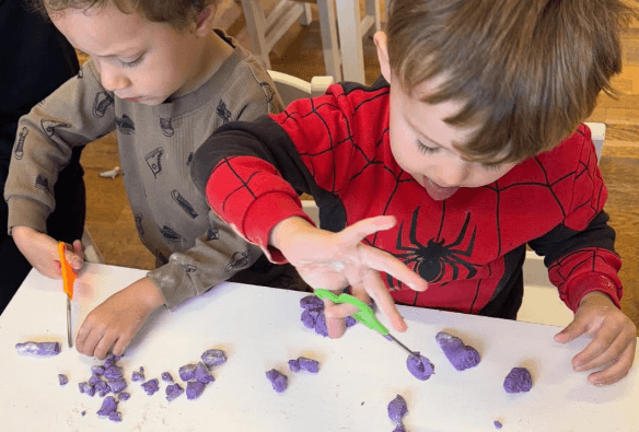 Children enjoying messy play and role play activities