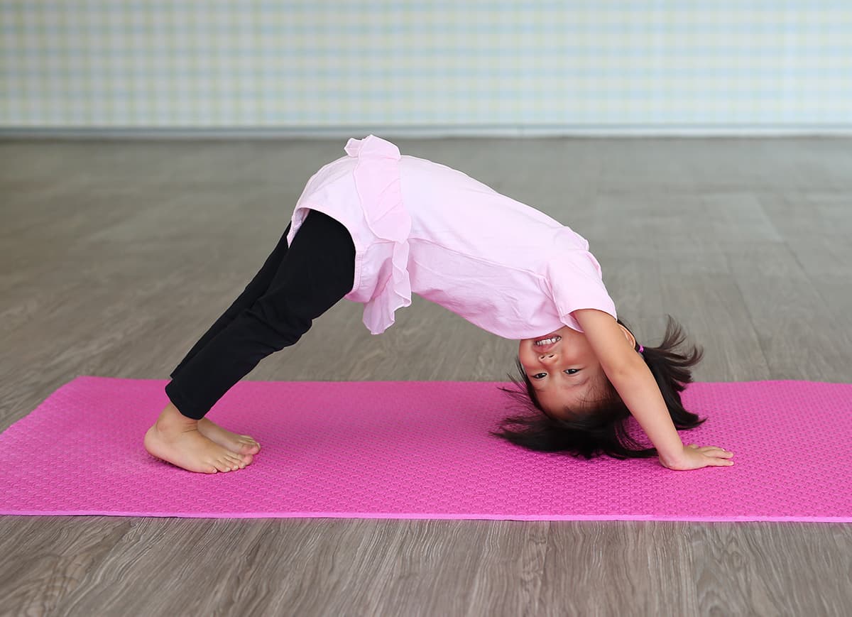 Children taking part in baby yoga and soft play activities